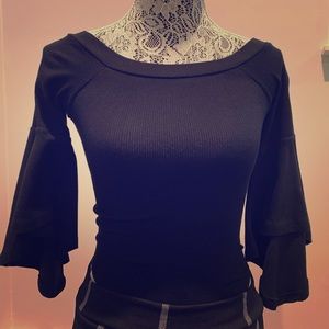 Tight fitting black shirt that connects at bottom